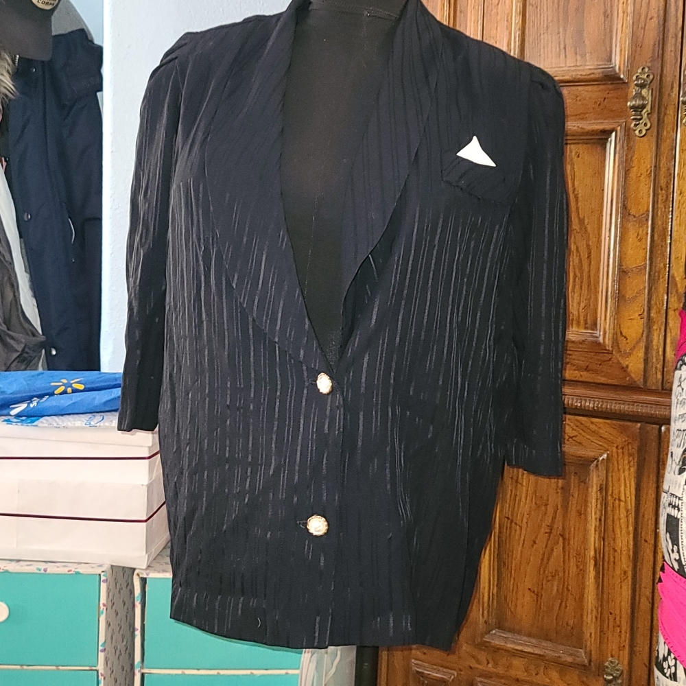 Navy blue suit jacket with white rose buttons